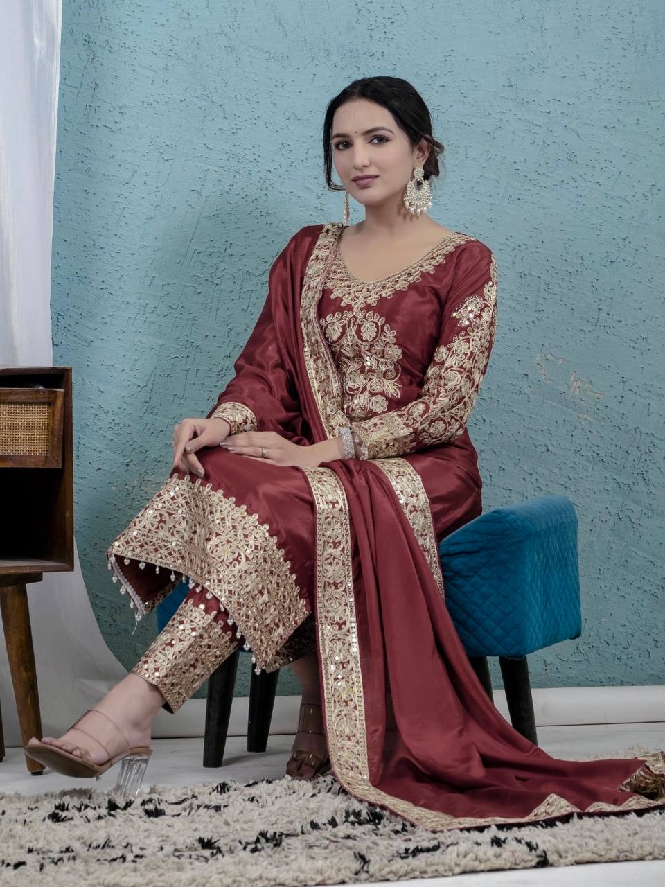 For a look that exudes understated elegance, envelop yourself in deep colors and elaborate accents. - Image 3
