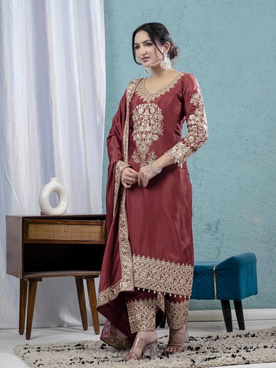For a look that exudes understated elegance, envelop yourself in deep colors and elaborate accents. - Image 4
