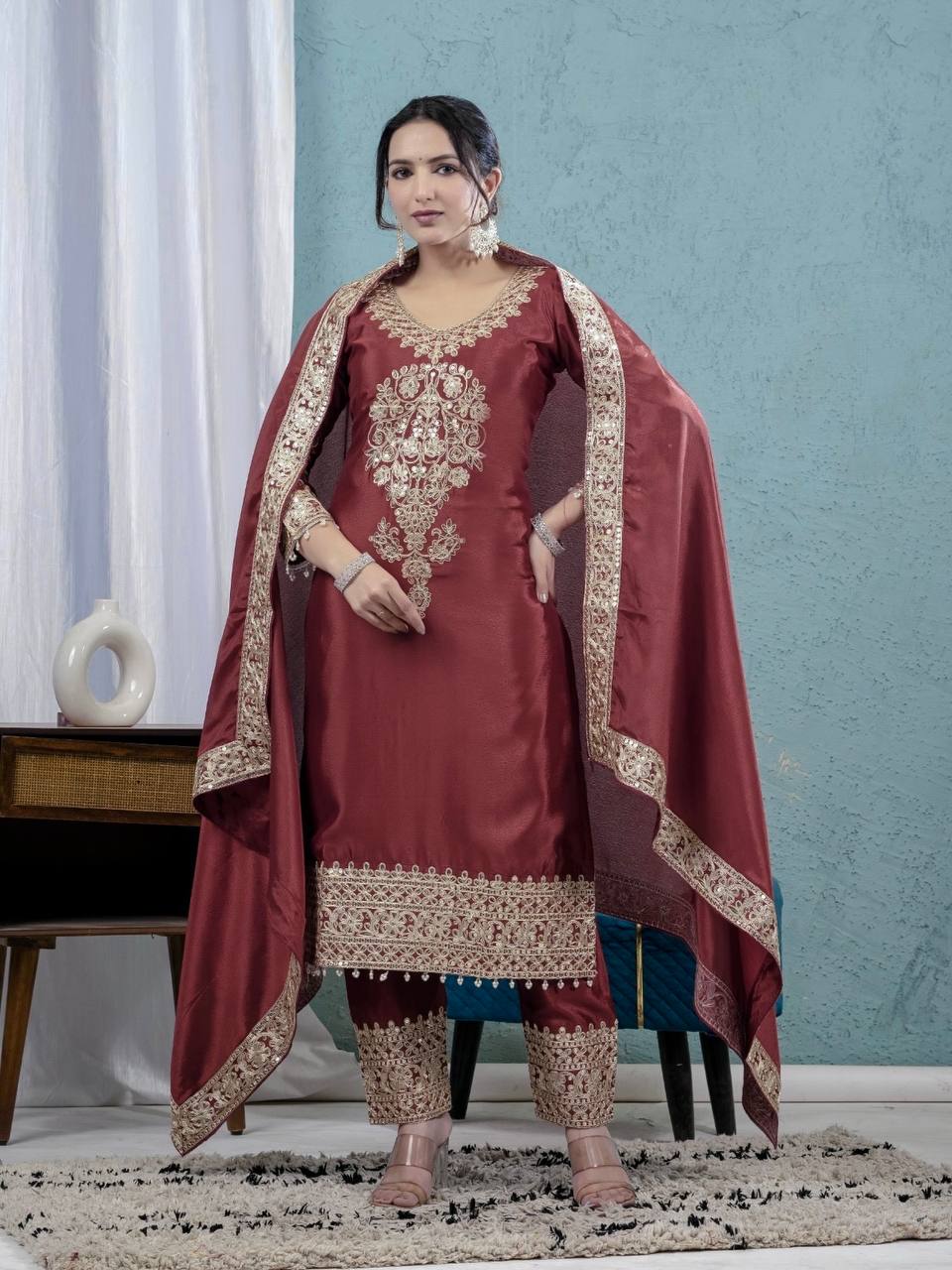 For a look that exudes understated elegance, envelop yourself in deep colors and elaborate accents. - Image 6